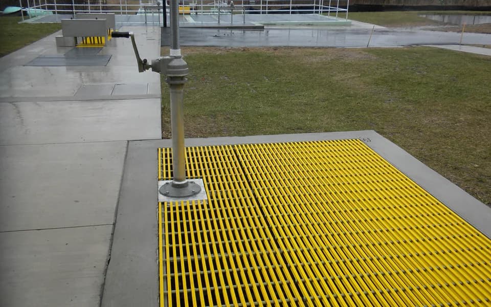 Yellow molded FRP grating panels on an industrial platform