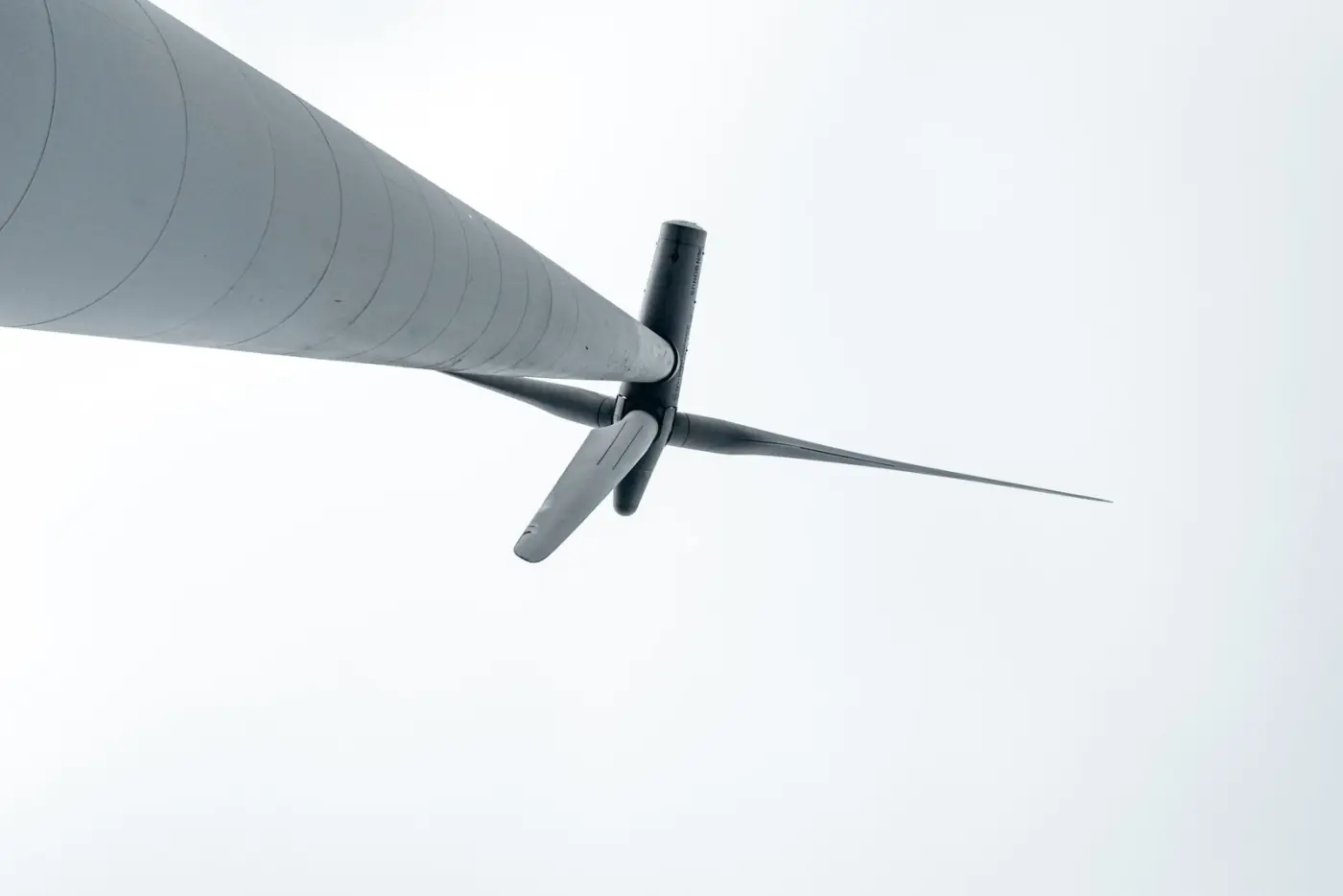 Close view of wind turbine blades representing wind and renewable-energy composite applications